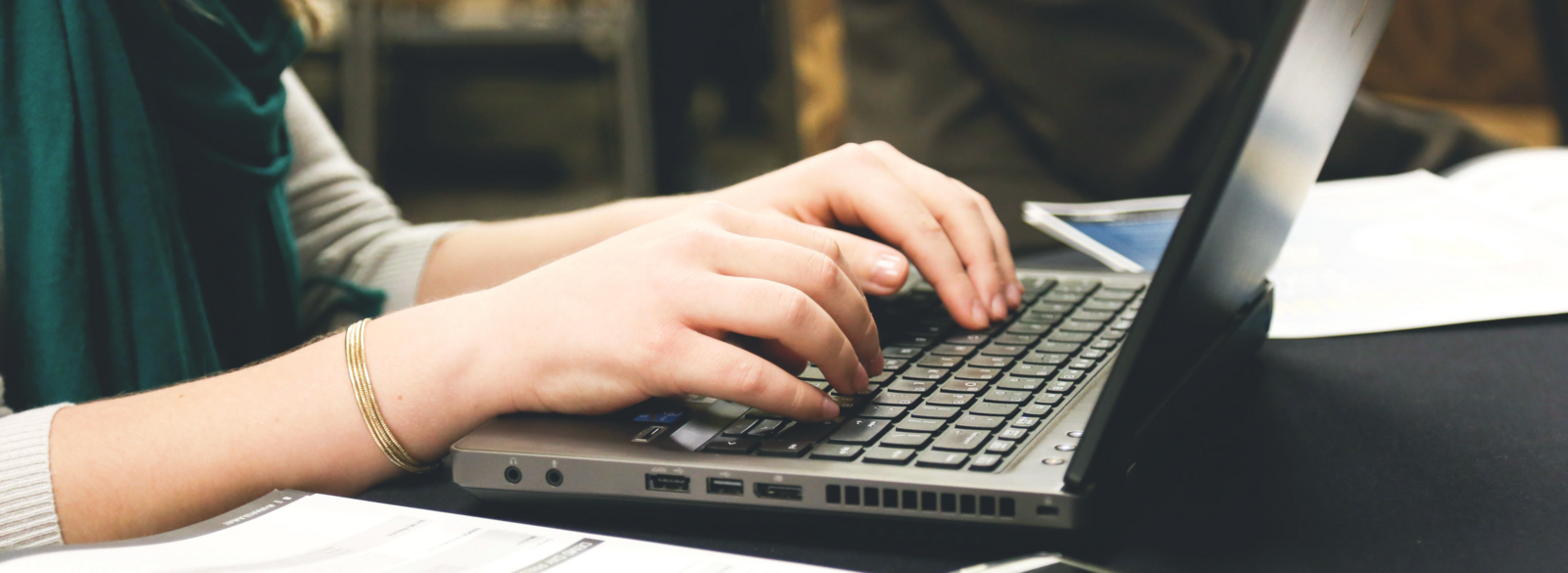 Hands on a laptop